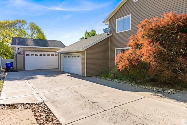1933 N 120 W, Tooele, UT 84074 - view of side of property featuring an attached garage and concrete driveway