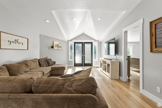 1933 N 120 W, Tooele, UT 84074 - living room with light wood-type flooring, lofted ceiling, and baseboards