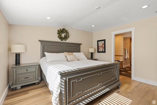 1933 N 120 W, Tooele, UT 84074 - bedroom with light wood finished floors, baseboards, recessed lighting, and connected bathroom