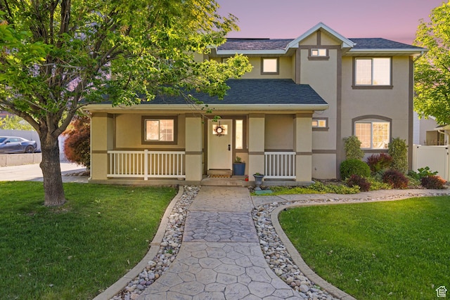 1933 N 120 W, Tooele, UT 84074 - view of front of home with stucco siding, a porch, and roof with shingles