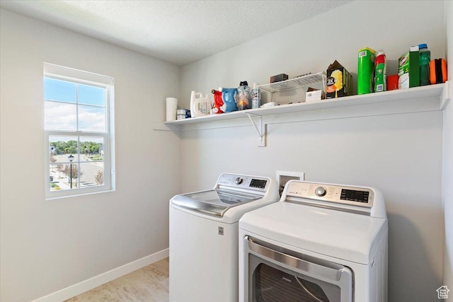 2221 W Prevedel Dr S, West Haven, UT 84401 - washroom featuring separate washer and dryer, baseboards, and a textured ceiling