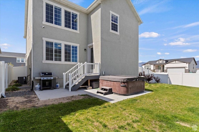2221 W Prevedel Dr S, West Haven, UT 84401 - rear view of property featuring a hot tub, a patio area, stucco siding, and central AC unit