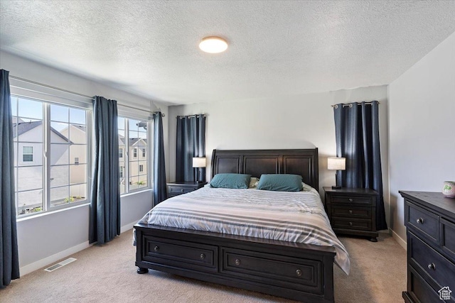 2221 W Prevedel Dr S, West Haven, UT 84401 - bedroom featuring light colored carpet, a textured ceiling, and baseboards