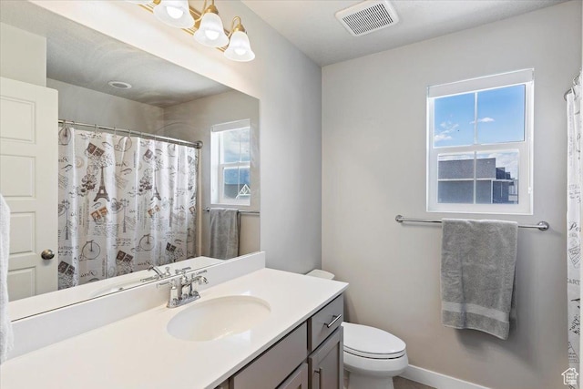 2221 W Prevedel Dr S, West Haven, UT 84401 - bathroom with toilet, vanity, and curtained shower