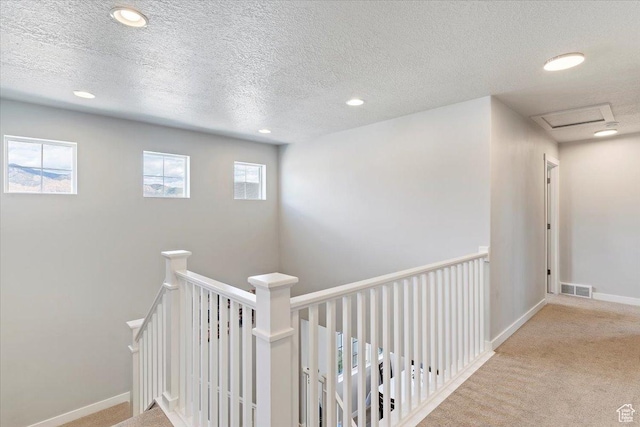 2221 W Prevedel Dr S, West Haven, UT 84401 - hall with recessed lighting, a textured ceiling, carpet floors, baseboards, and an upstairs landing