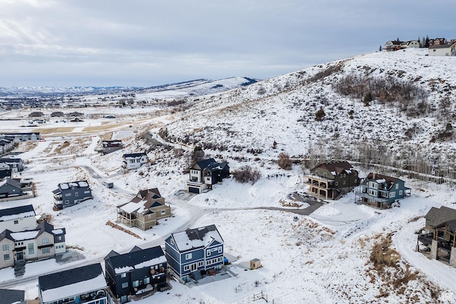 660 N Lochwood Dr # 69, Garden City, UT 84028 - snowy aerial view with a mountain view and a residential view