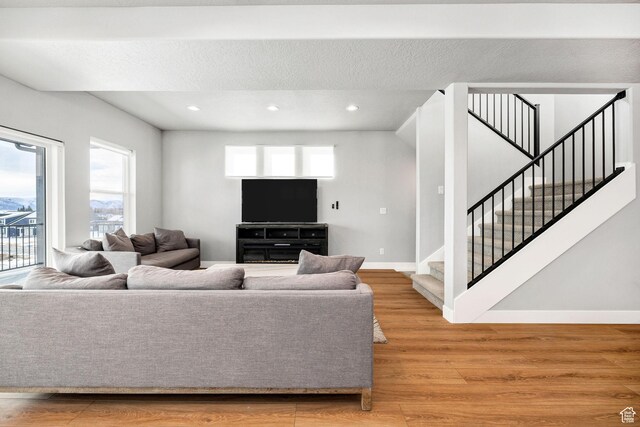 660 N Lochwood Dr # 69, Garden City, UT 84028 - living area featuring stairs, light wood-style floors, baseboards, and recessed lighting