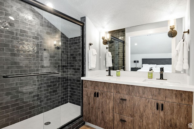 660 N Lochwood Dr # 69, Garden City, UT 84028 - ensuite bathroom with a shower stall, double vanity, and a textured ceiling