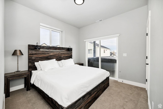 660 N Lochwood Dr # 69, Garden City, UT 84028 - bedroom with carpet flooring, baseboards, and access to outside
