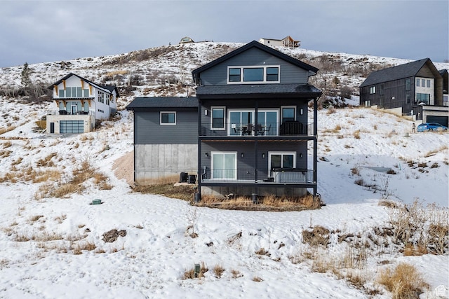 660 N Lochwood Dr # 69, Garden City, UT 84028 - snow covered back of property featuring a balcony