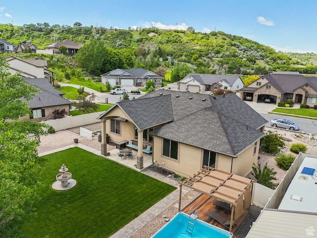 7538 S 1740 E, South Weber, UT 84405 - back of house with stucco siding, a shingled roof, a residential view, and a patio area