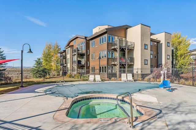 6749 N 2200 W Unit B102, Park City, UT 84098 - community pool featuring a hot tub and a patio area