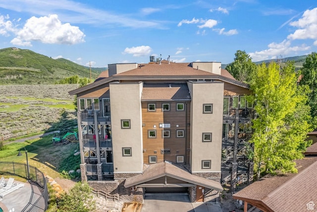 6749 N 2200 W Unit B102, Park City, UT 84098 - view of building exterior with a mountain view