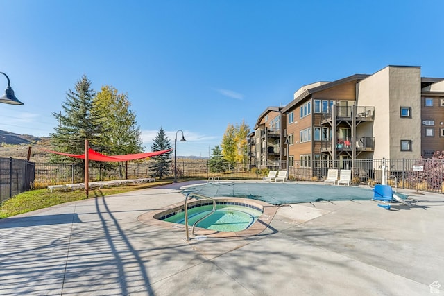6749 N 2200 W Unit B102, Park City, UT 84098 - community pool featuring a hot tub and a patio area