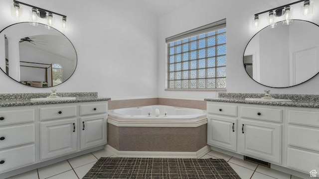 5557 W 13680 S, Herriman, UT 84096 - bathroom featuring a ceiling fan, tile patterned flooring, a garden tub, and two vanities