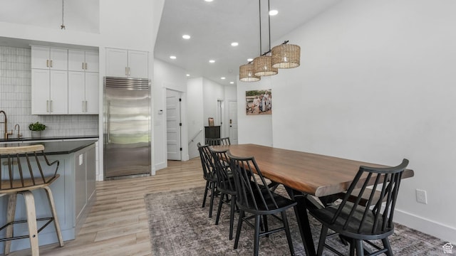 5557 W 13680 S, Herriman, UT 84096 - dining room featuring light wood-style flooring, recessed lighting, and baseboards
