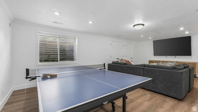5557 W 13680 S, Herriman, UT 84096 - recreation room featuring ornamental molding, a textured ceiling, recessed lighting, wood finished floors, and baseboards