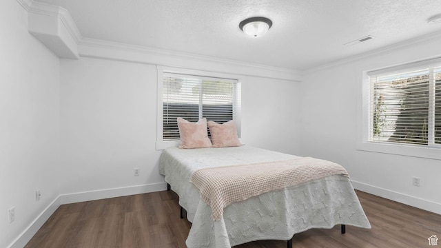 5557 W 13680 S, Herriman, UT 84096 - bedroom featuring multiple windows, wood finished floors, baseboards, ornamental molding, and a textured ceiling