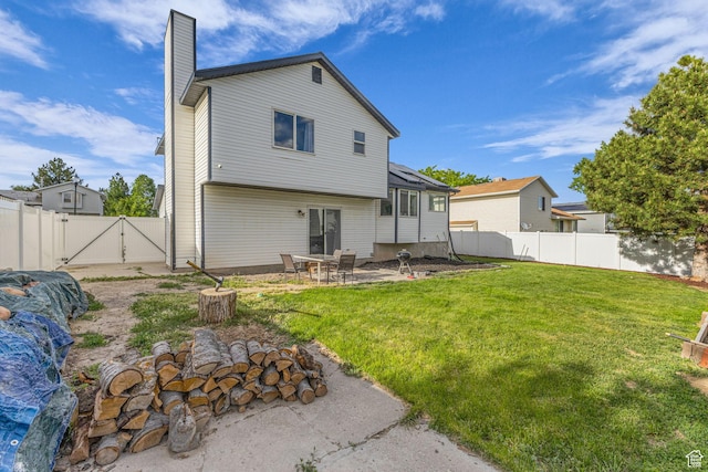 5131 W 6275 S, West Jordan, UT 84081 - back of property with a gate, a chimney, and a patio