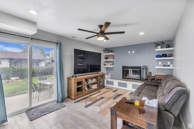 5131 W 6275 S, West Jordan, UT 84081 - living room featuring a glass covered fireplace, ceiling fan, and recessed lighting