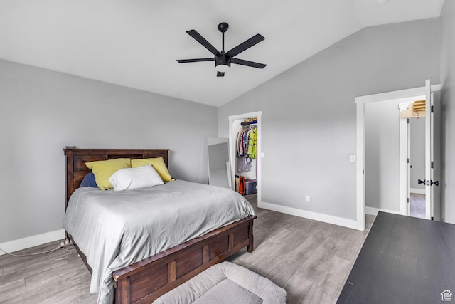 5131 W 6275 S, West Jordan, UT 84081 - bedroom with lofted ceiling, wood finished floors, a walk in closet, and baseboards