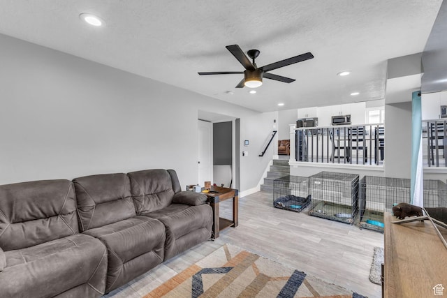 5131 W 6275 S, West Jordan, UT 84081 - living area featuring a ceiling fan, light wood-style floors, stairs, recessed lighting, and a textured ceiling