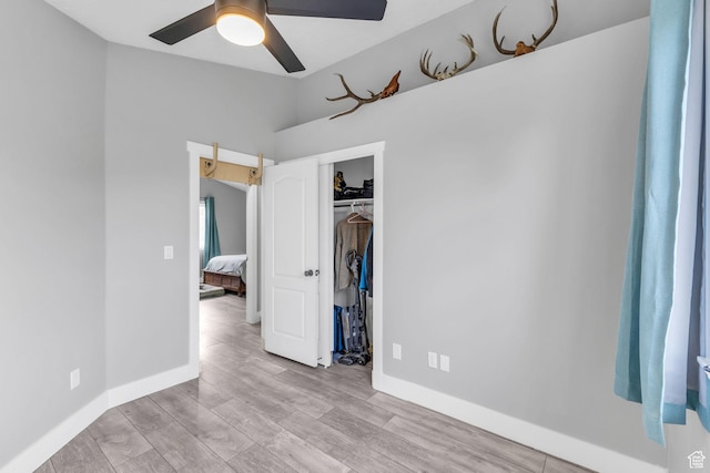 5131 W 6275 S, West Jordan, UT 84081 - unfurnished bedroom featuring wood finished floors, a closet, baseboards, ceiling fan, and vaulted ceiling