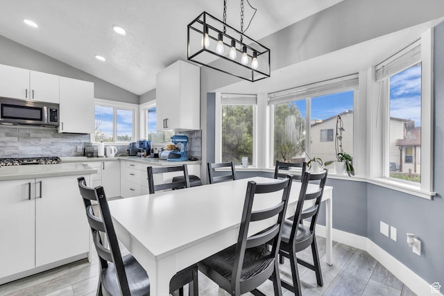 5131 W 6275 S, West Jordan, UT 84081 - dining area with lofted ceiling, light wood-style floors, recessed lighting, and baseboards