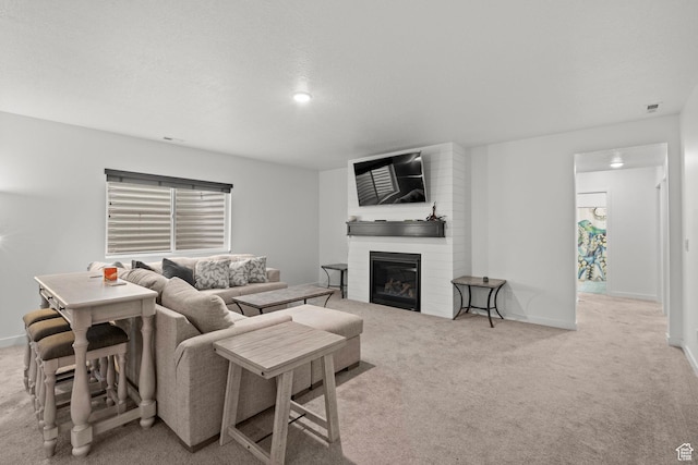 11242 S Willow Dr, South Jordan, UT 84009 - living area with carpet, a fireplace, and baseboards