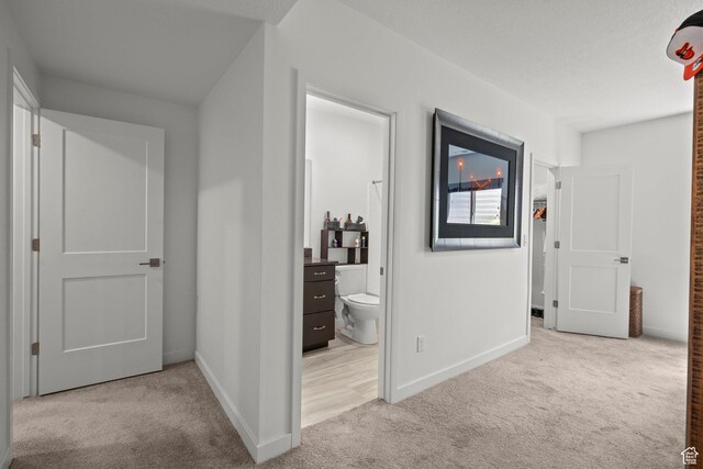 11242 S Willow Dr, South Jordan, UT 84009 - hallway with light colored carpet and baseboards