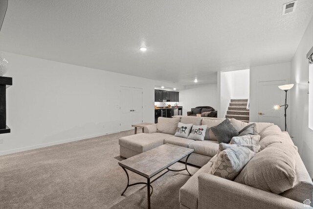 11242 S Willow Dr, South Jordan, UT 84009 - living room with bar, light colored carpet, stairway, and baseboards