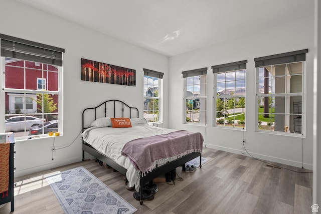 11242 S Willow Dr, South Jordan, UT 84009 - bedroom featuring wood finished floors and baseboards