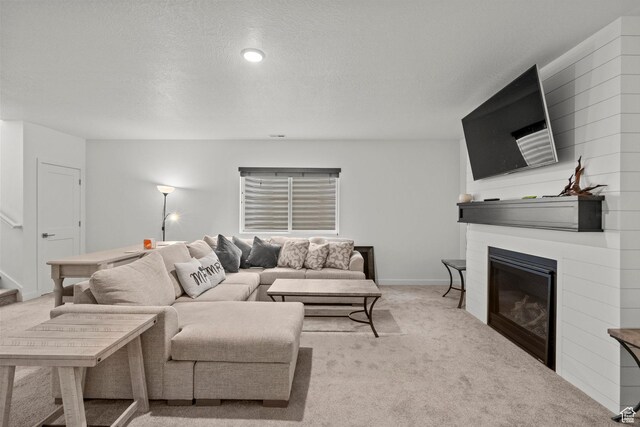 11242 S Willow Dr, South Jordan, UT 84009 - living room with light carpet, a fireplace, a textured ceiling, and baseboards