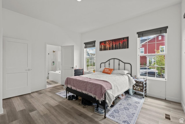 11242 S Willow Dr, South Jordan, UT 84009 - bedroom featuring light wood finished floors, connected bathroom, and baseboards