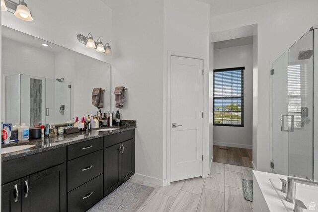 11242 S Willow Dr, South Jordan, UT 84009 - bathroom with a stall shower, double vanity, and baseboards