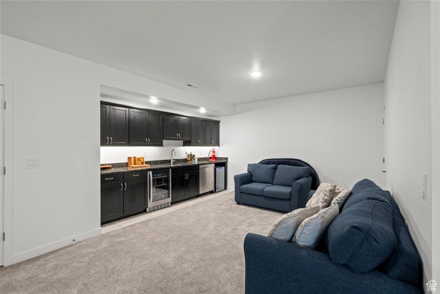 11242 S Willow Dr, South Jordan, UT 84009 - living room with beverage cooler, bar with sink, light colored carpet, baseboards, and recessed lighting