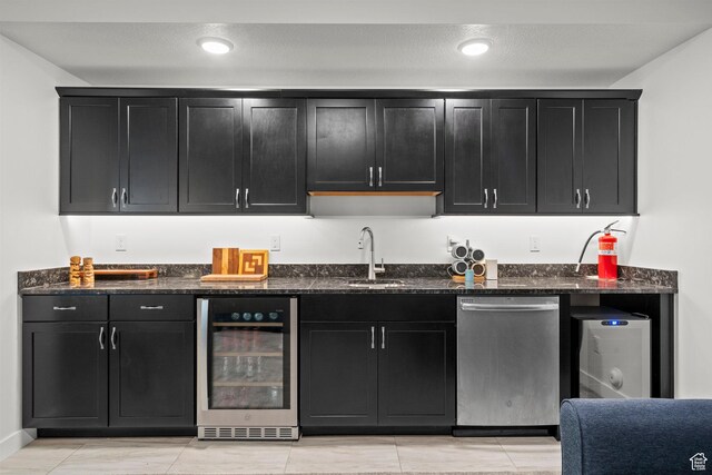 11242 S Willow Dr, South Jordan, UT 84009 - kitchen featuring wine cooler, dishwasher, dark cabinets, dark stone counters, and a sink