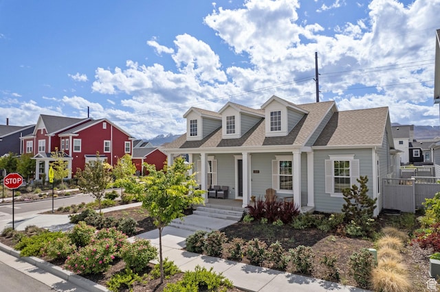 11242 S Willow Dr, South Jordan, UT 84009 - cape cod home with a porch, a shingled roof, and a residential view