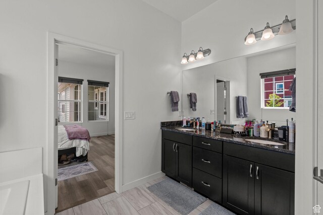11242 S Willow Dr, South Jordan, UT 84009 - full bath featuring double vanity, baseboards, and ensuite bath