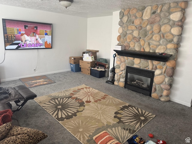 197 E Utah Ave, Payson, UT 84651 - living room with carpet flooring, a textured ceiling, a fireplace, and baseboards