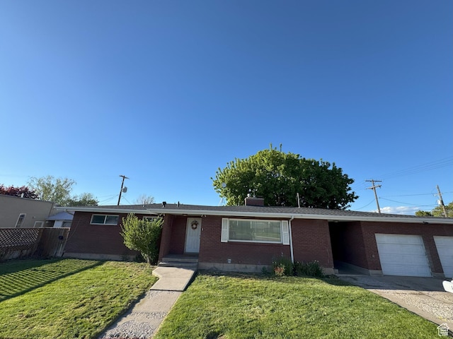 197 E Utah Ave, Payson, UT 84651 - ranch-style house with brick siding, a garage, and concrete driveway