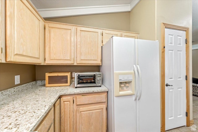 1040 N 1300th St Unit 52, St George, UT 84770 - kitchen with white refrigerator with ice dispenser, light brown cabinetry, and lofted ceiling