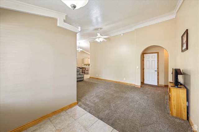 1040 N 1300th St Unit 52, St George, UT 84770 - unfurnished room with ceiling fan, ornamental molding, arched walkways, baseboards, and light carpet