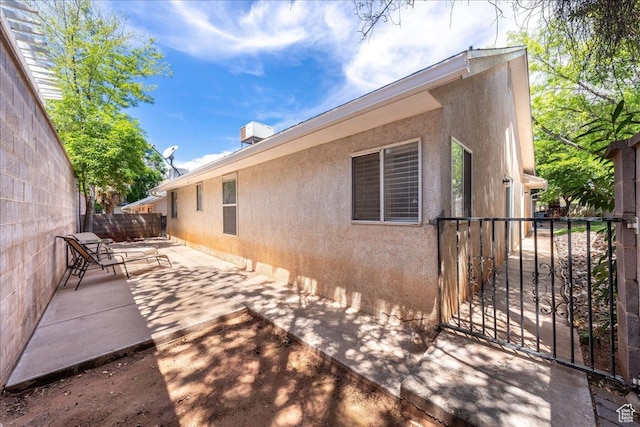 1040 N 1300th St Unit 52, St George, UT 84770 - view of property exterior with a patio area and stucco siding