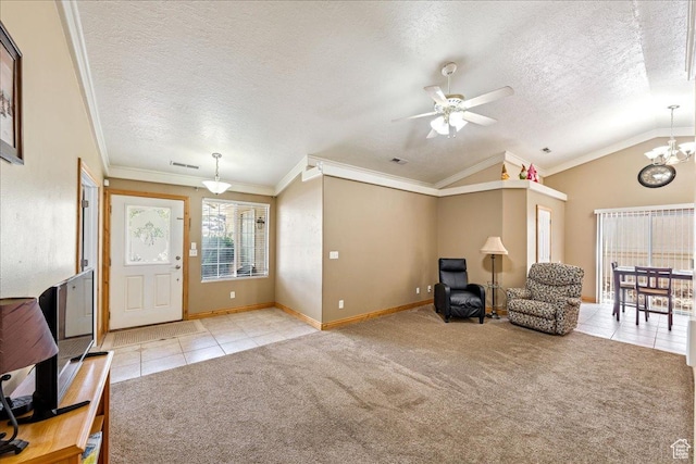 1040 N 1300th St Unit 52, St George, UT 84770 - entrance foyer featuring light tile patterned floors, a textured ceiling, light colored carpet, a chandelier, and ceiling fan