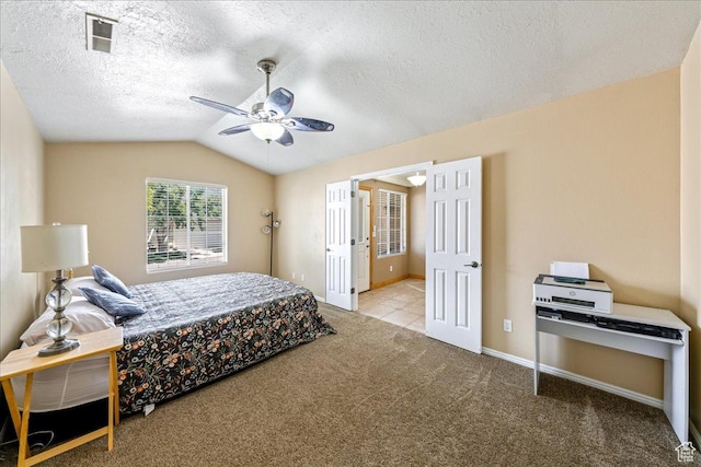 1040 N 1300th St Unit 52, St George, UT 84770 - bedroom featuring carpet floors, lofted ceiling, ceiling fan, a textured ceiling, and baseboards