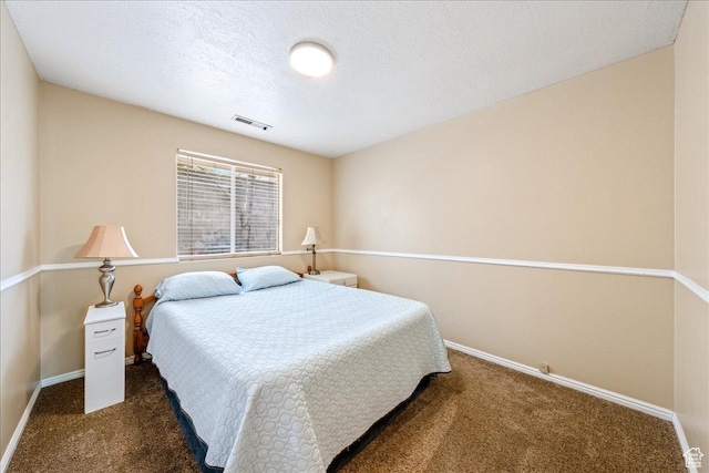 1040 N 1300th St Unit 52, St George, UT 84770 - carpeted bedroom featuring baseboards and a textured ceiling