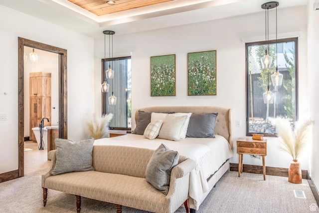 900 W Weber Canyon Rd, Oakley, UT 84055 - bedroom featuring light colored carpet, multiple windows, ensuite bathroom, and baseboards