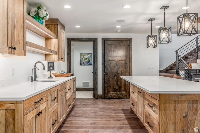 900 W Weber Canyon Rd, Oakley, UT 84055 - kitchen featuring a sink, dark wood-style flooring, light countertops, recessed lighting, and decorative light fixtures