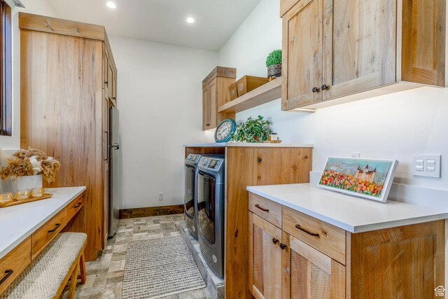 900 W Weber Canyon Rd, Oakley, UT 84055 - washroom with independent washer and dryer, cabinet space, baseboards, recessed lighting, and light stone finish floors